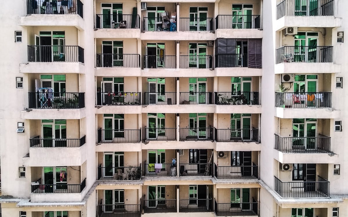 An apartment building with rows of balconies
